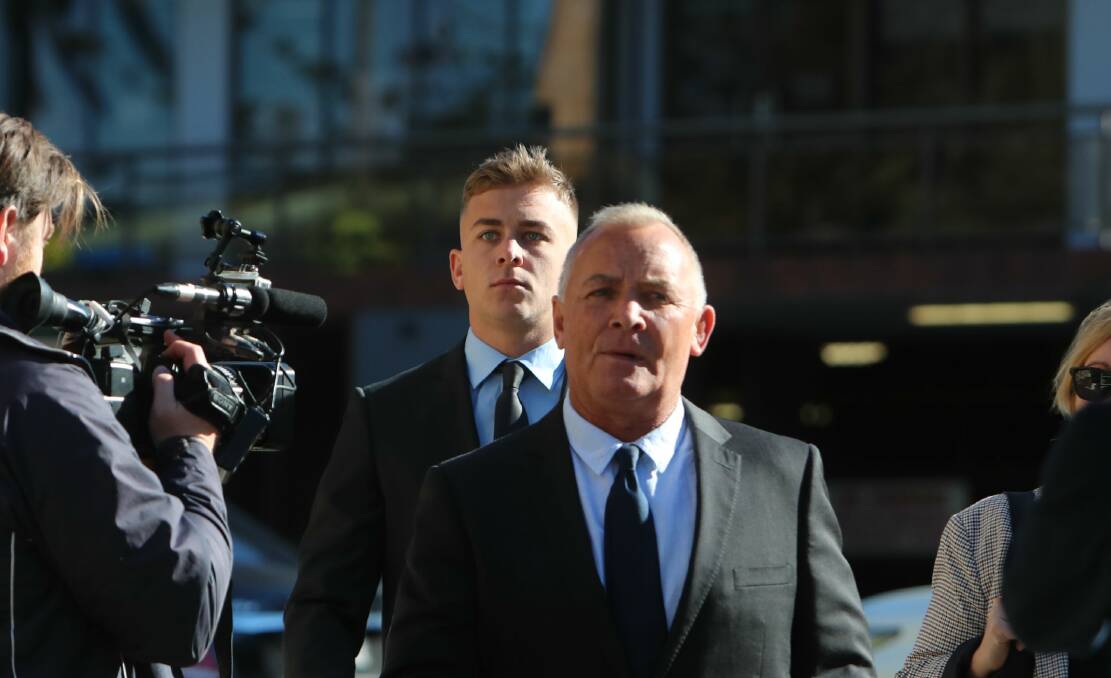 Callan Sinclair (back) outside Wollongong Local Court on Tuesday. Picture: Sylvia Liber