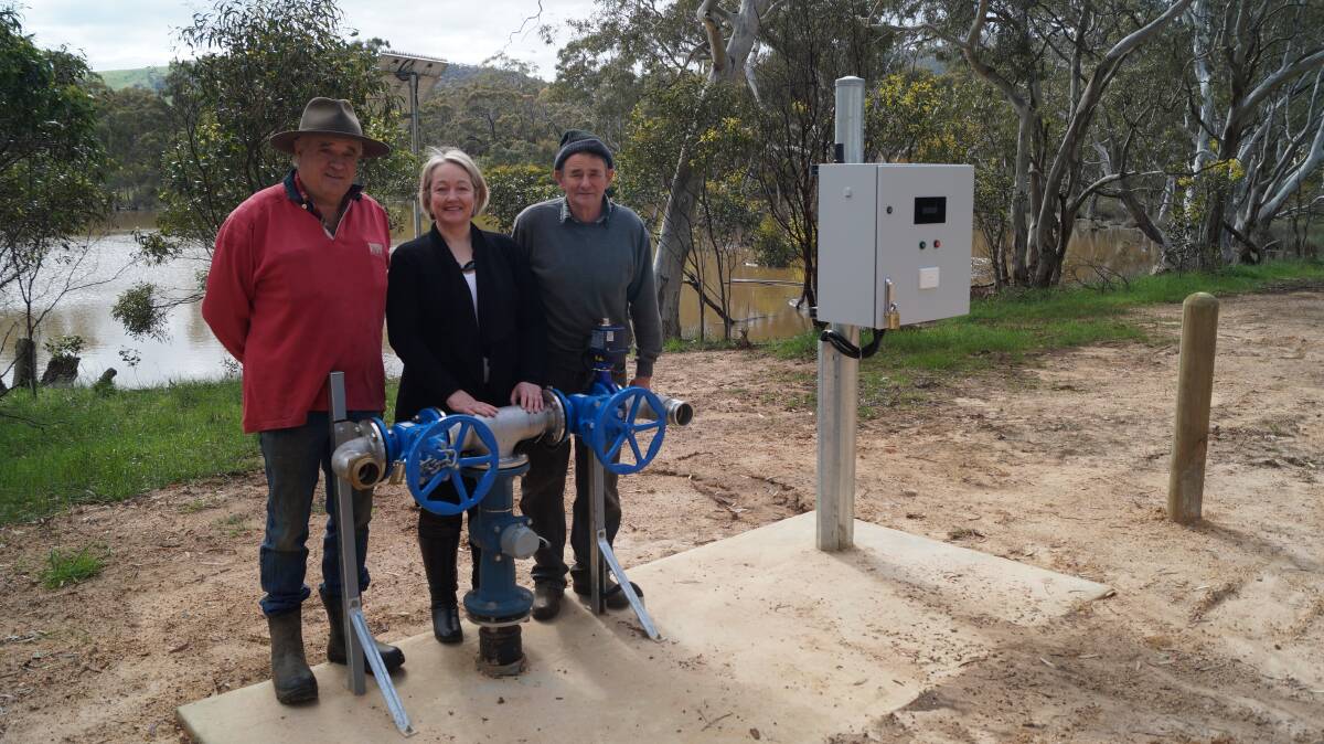 Norval farmers James Brady, Ripon MP Louise Staley and farmer Ian Brady inspect the new standpipe at Norval Dam.