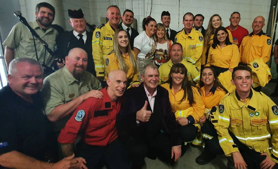 'Unreal experience': RFS volunteers were invited to the Fire Fight Australia concert, went on stage and got photos with music royalty. Picture: Brett Thomas