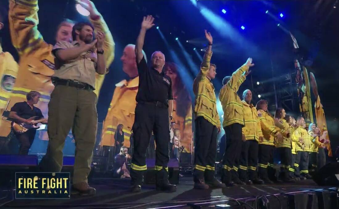 RFS members and international firefighters where cheered on stage. Picture: NSW RFS Twitter