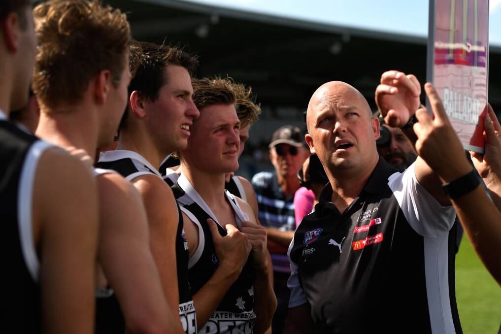 Marc Greig, Senior Coach of the Rebels addresses his players. (Picture: Adam Trafford)