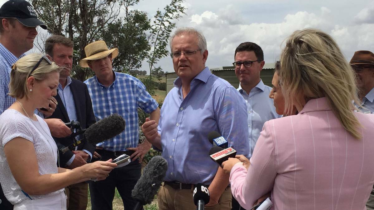 Prime Minister Scott Morrison announced drought relief funding for a number of councils in the Central West in Blayney on Tuesday. Photo: JUDE KEOGH