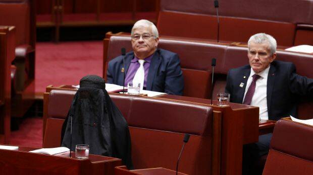 One Nation leader Pauline Hanson wears a burqa during Question Time at Parliament House. Photo: Alex Ellinghausen