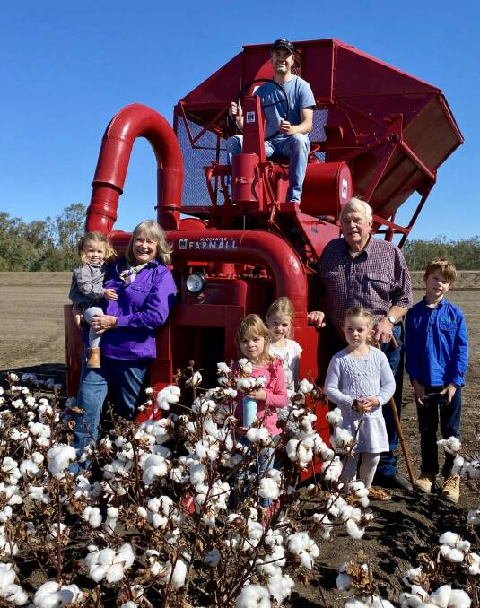 HAPPY FAMILY: Wendy and Ronan Revell, their son Matthew (in driver's seat) and their grandchildren Imogen, Everly, Maggie, Rachel and Harry with the restored IH M-12-H cotton picker. 