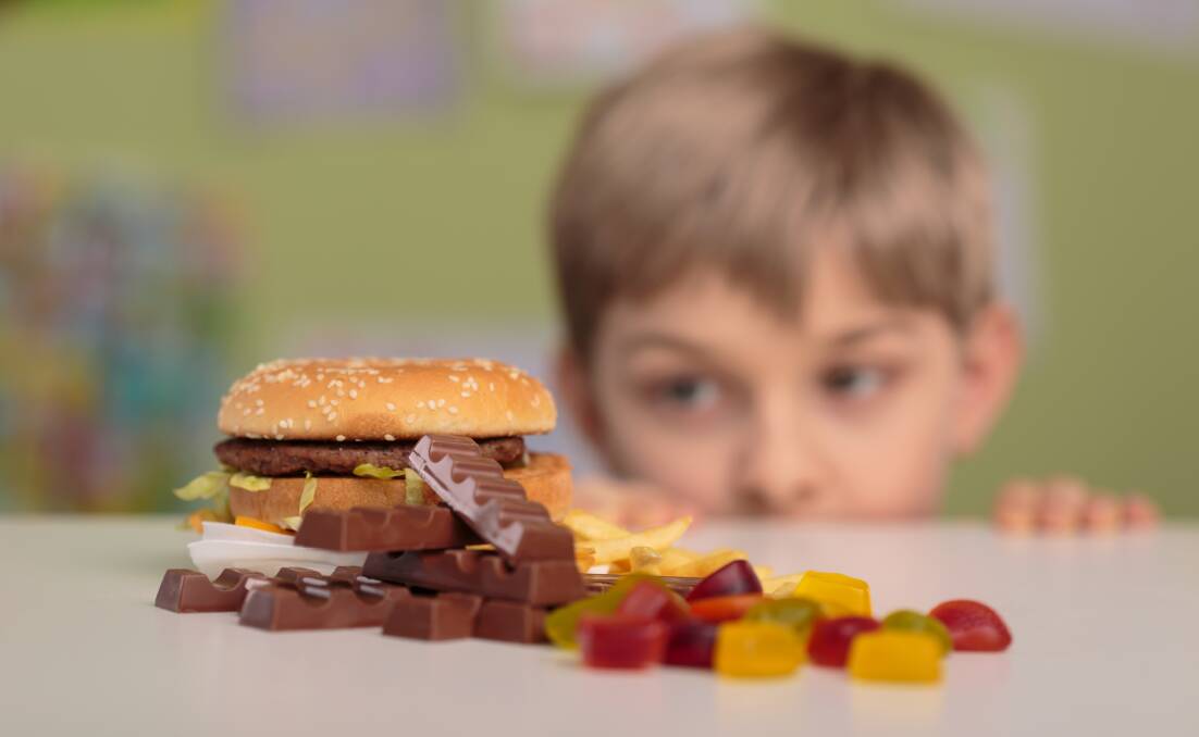 Health risks: Children who have a habit of consuming energy-dense foods and have a poor diet, will live with risk factors such as obesity for a long time. Photo - supplied.