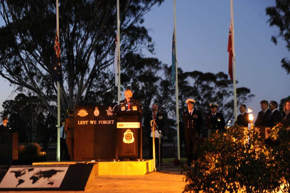 WE WILL REMEMBER THEM: Horsham RSL president Bob Lockwood at last year's ANZAC Day dawn service. People are encouraged to observe a minute's silence in their driveways at dawn this April, 25.