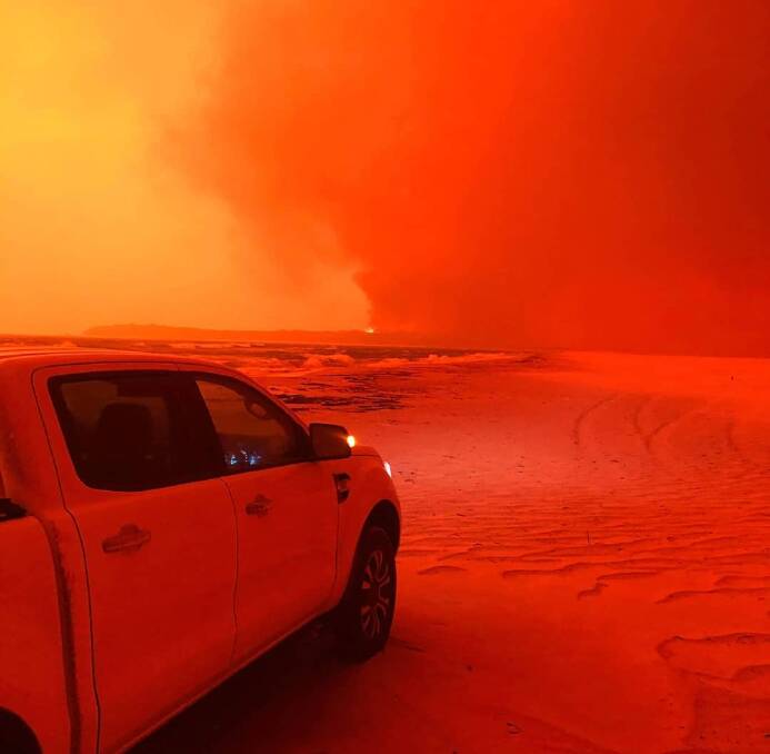 Photo of the Week: A reader sent us this shot of his ute on the beach at Mallacoota on New Year's Day during the fires. Want to send in a shot? See below