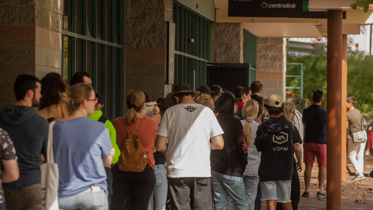 Long queues of suddenly jobless people have formed outside Centrelink offices in the last two days.