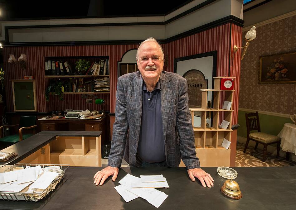Back behind the desk on the set of the Faulty Towers stage production in London. Picture Getty Images