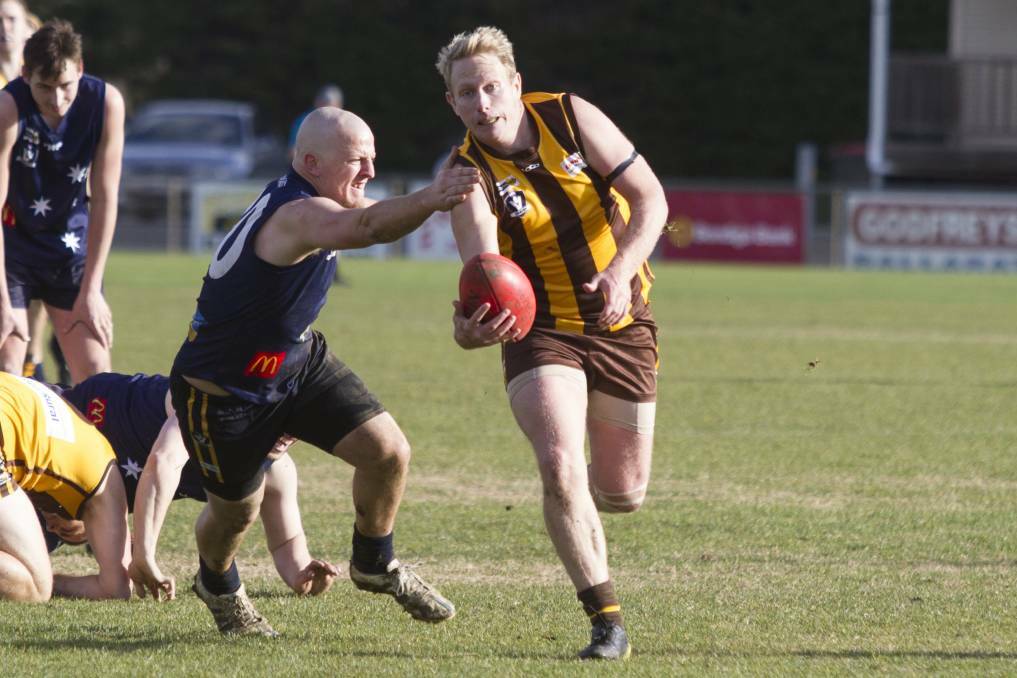 CONTEST: Tatyoon's Tim McDougall evades an Ararat Eagles opponent during a match between the two teams last season. Picture: Peter Pickering