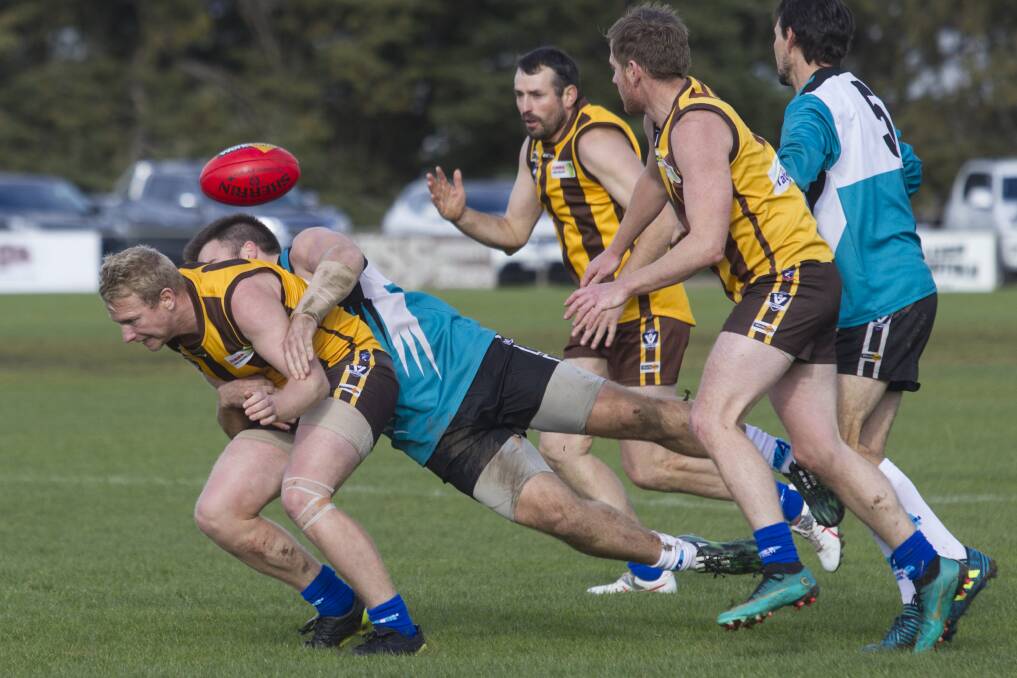 CONTEST: Tim McDougall gets a heavy tackle during the round nine game against Moyston-Willaura. Picture: PETER PICKERING