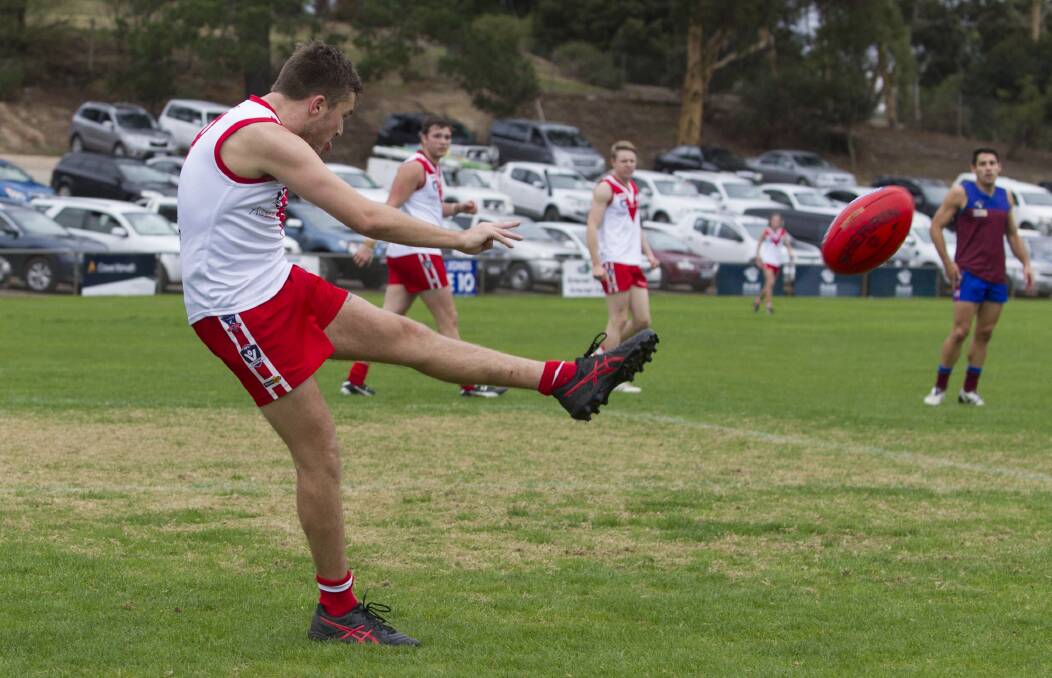 BIG BOOT: Ararat's Jacob Bates gets his kick away during the match against Horsham Demons earlier this season. Picture: Peter Pickering