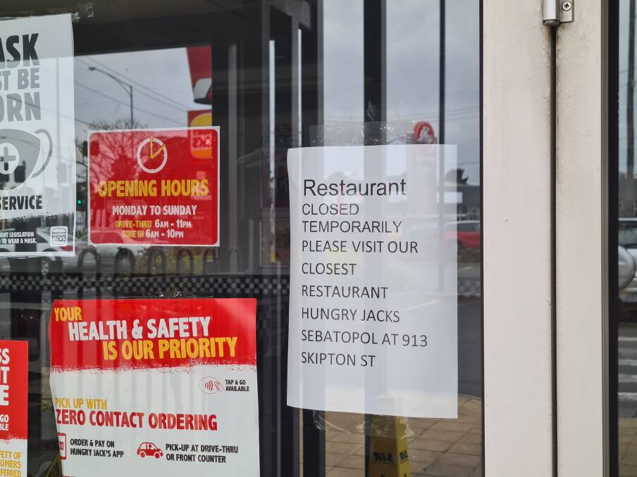 A sign on the door at the Wendouree Hungry Jack's on Tuesday morning.