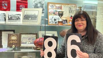 RICH HISTORY: Ararat and District Historical Society president Tammi Munro with part of Langi Morgala Museum's latest exhibition, dedicated to the former Ararat and District Football Association. Picture: CONTRIBUTED