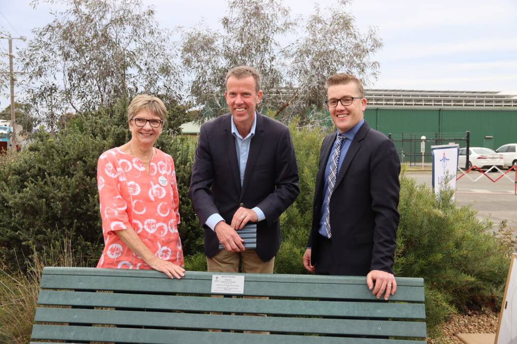 HONOUR: Ararat Legacy President Christine Doak, member for Wannon, Dan Tehan, and AME Systems Managing Director, Nick Carthew, open the Peter Carthew AM 'seat of reflection' at the Ararat Legacy Memorial Garden Picture: CONTRIBUTED