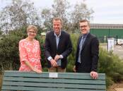 HONOUR: Ararat Legacy President Christine Doak, member for Wannon, Dan Tehan, and AME Systems Managing Director, Nick Carthew, open the Peter Carthew AM 'seat of reflection' at the Ararat Legacy Memorial Garden Picture: CONTRIBUTED