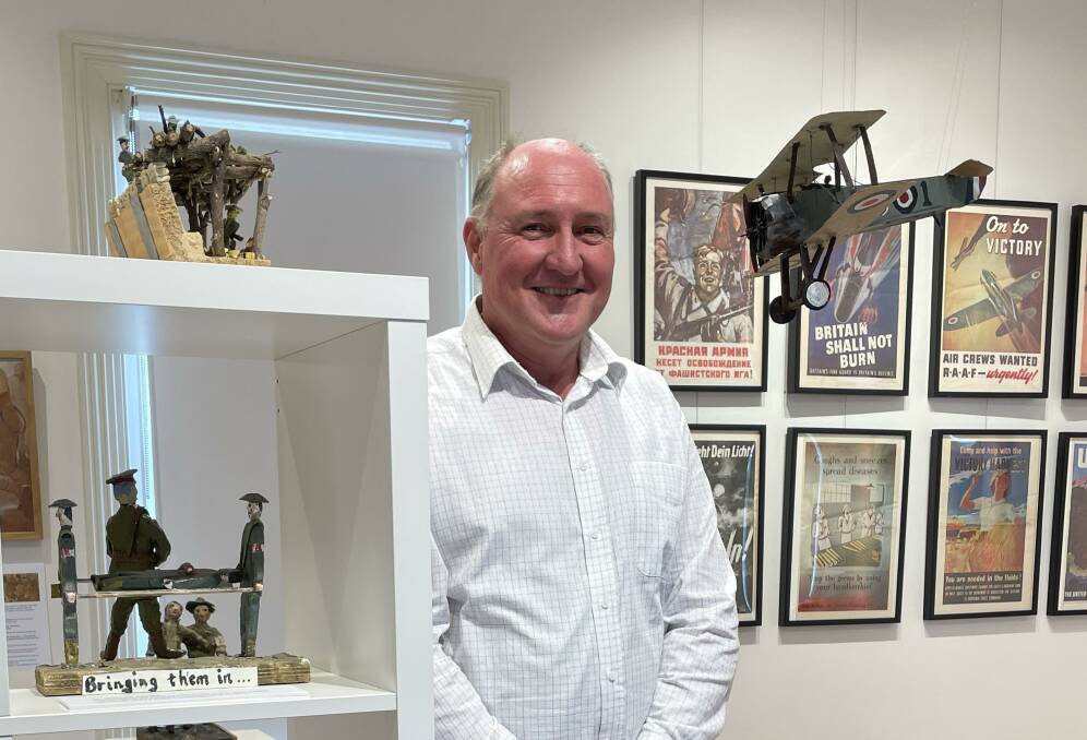 BIG PICTURE: Artist historian Gary Serpell with his miniature artworks at the Willaura Modern Railway Station Gallery. Picture: CONTRIBUTED
