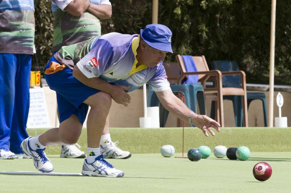 Pennant: Peter Dohnt keeps a close eye on his bowl down the rink. Picture: PETER PICKERING