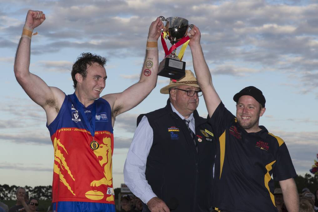 Great Western captain Nigel Sibson and coach Will Bell hold up the 2019 cup