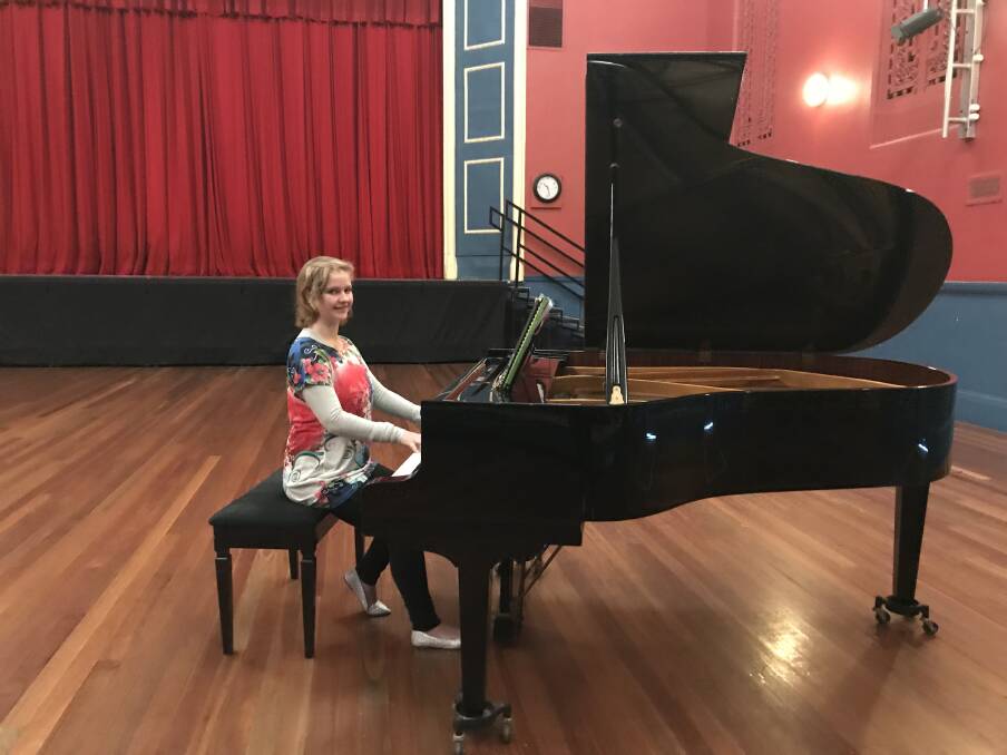GRAND: SPACi member Alanis Williams at the grand piano in the Stawell Town Hall. Picture: CONTRIBUTED
