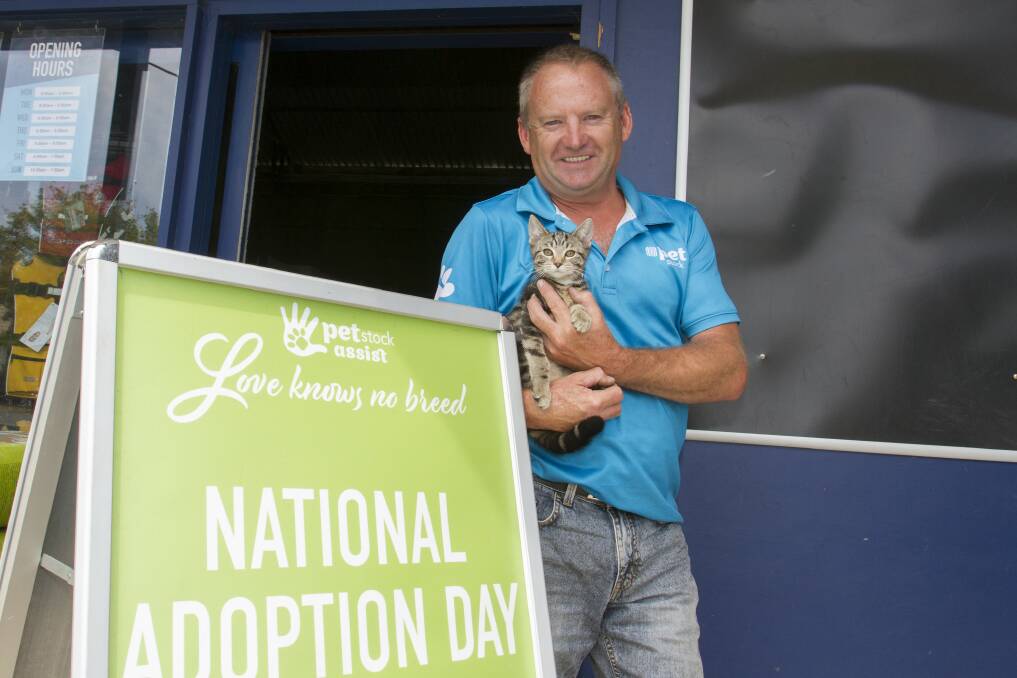 READY: PETstock's Darren Smith with an adoptee ready for the journey of possibly finding a new home on Saturday at Stawell's National Adoption Day celebrations. Picture: PETER PICKERING