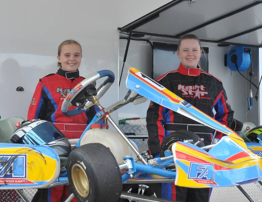 READY: Grace and Ella Dunmore will become 
grid kids at Melbourne Grand Prix. 
Picture: CASSANDRA LANGLEY