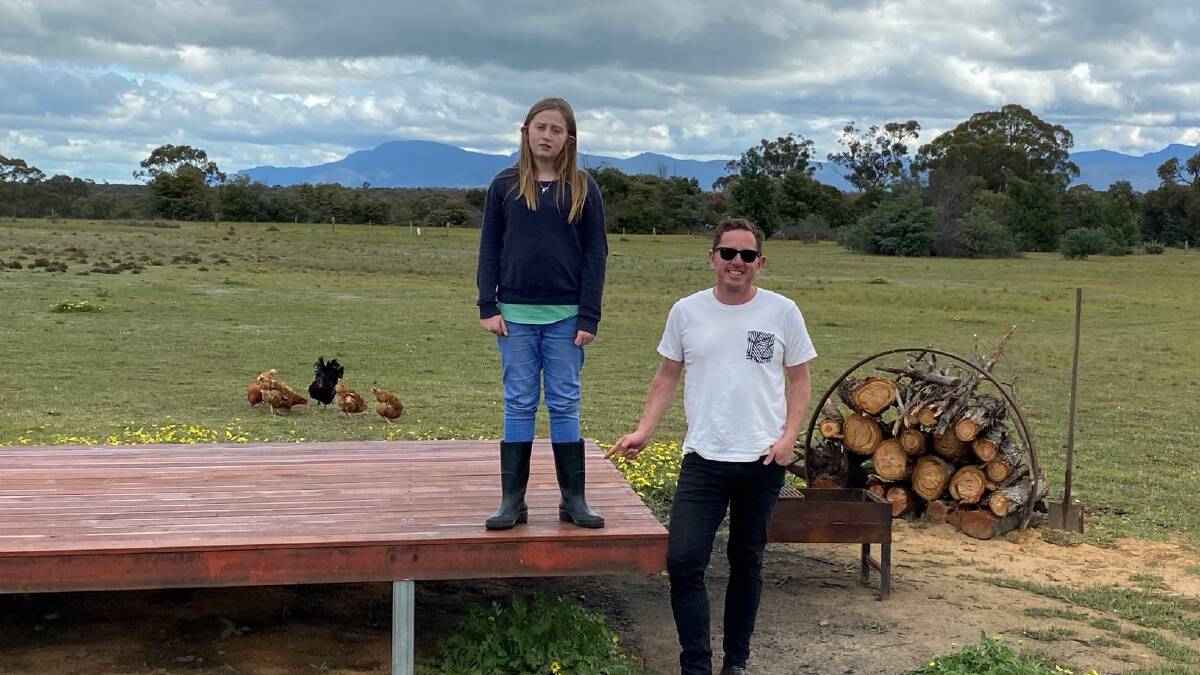 SAFETY: Luke Kane has convinced his daughter Heidi to wear gumboots on the
family property after she was bitten by a snake. Picture: LULU KANE