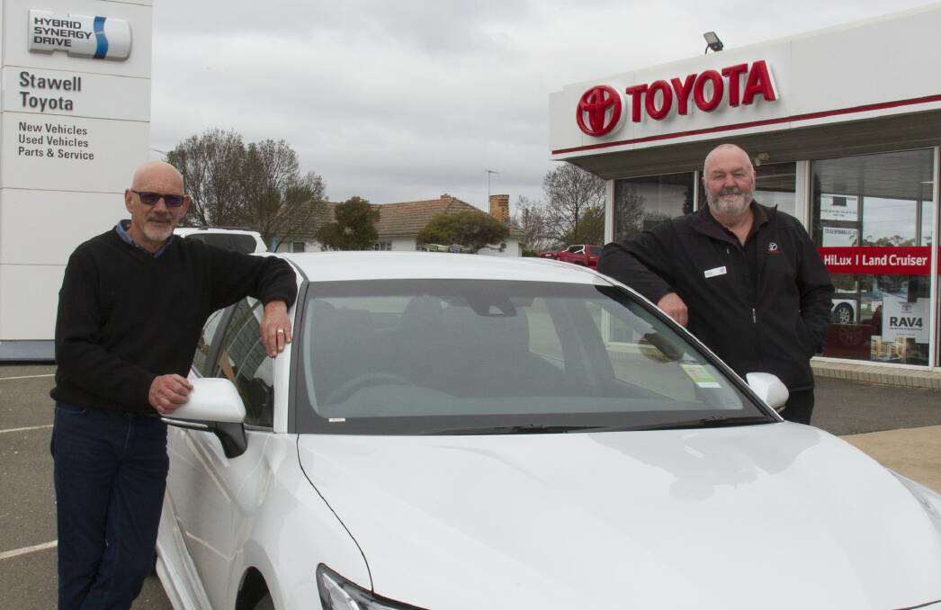 NEW FACE: Ian Taylor and his family are excited to work with existing staff such as Jamie Erwin after they bought out Stawell Toyota. Picture: PETER PICKERING