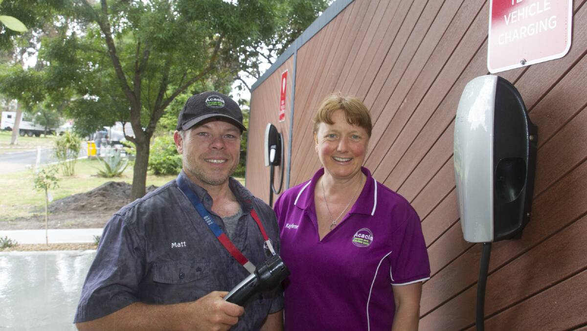 POINT OF DIFFERENCE: Matt and Kaylene Linsley are excited to welcome guests who want to use the Tesla charging station at Acacia Caravan Park. Picture: PETER PICKERING
