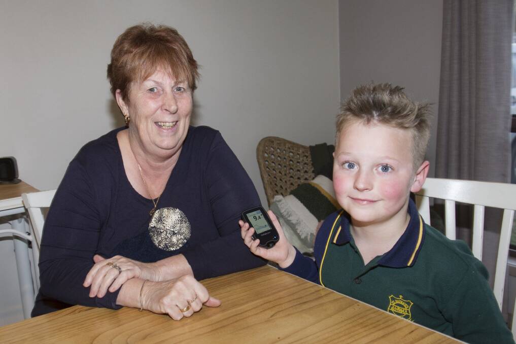 EDUCATION: Susan Power shares the insight into life with diabetes with her grandson Kobe who helps look out for signs. Picture: PETER PICKERING