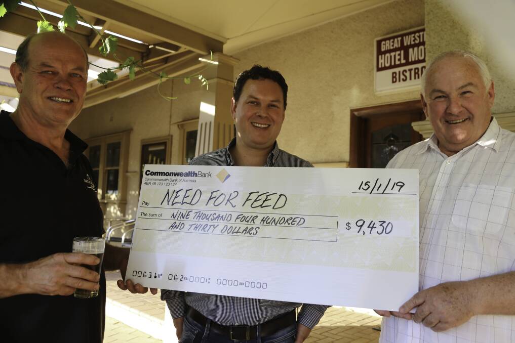DONATION: Great Western Hotel's Bruce Ahchow, Danial Ahchow Northern Grampians Shire mayor Kevin Erwin receiving $9430 from the patrons of the Great Western Hotel on behalf of Lions Australia “Need for Feed”. Picture: CONTRIBUTED