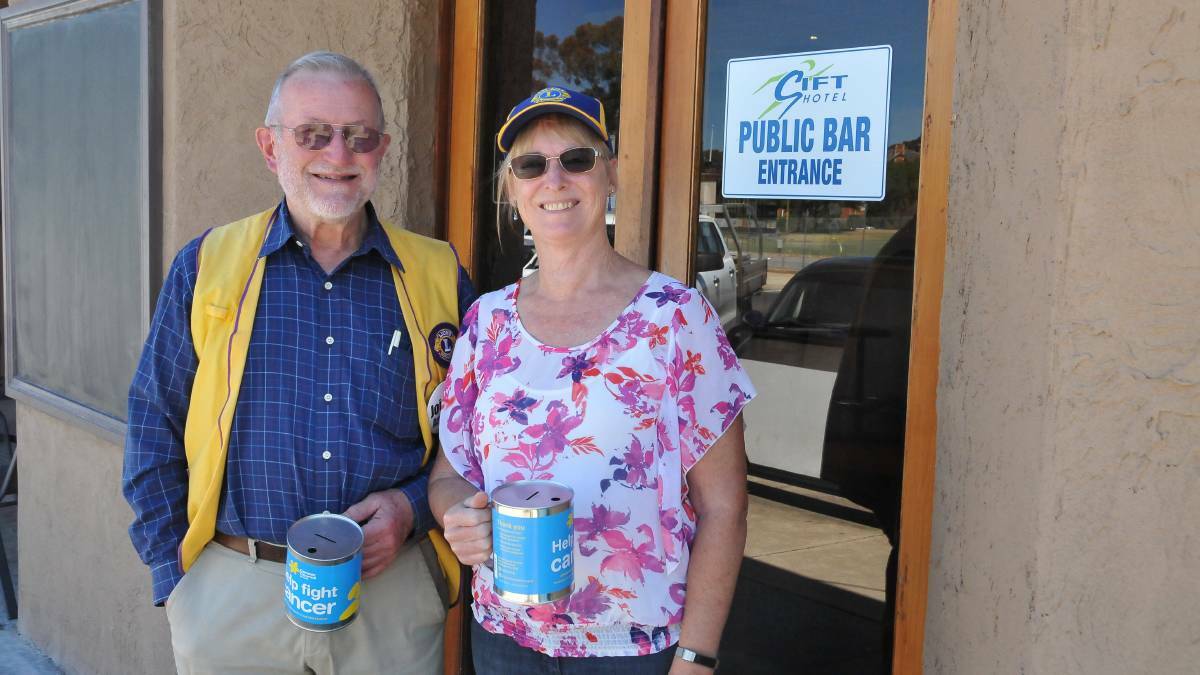 HELPING HANDS: Stawell Lions Club member Peter Martin and president Marie Hosking volunteered their time on Melbourne Cup Day to raise funds. Picture: CASSANDRA LANGLEY
