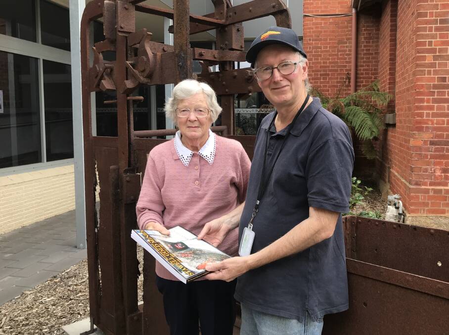 RELEASED: Stawell Historical Society president Dorothy Brumby congratulates Greg Cameron on his new book based on the history of gold mining in Stawell. Picture: CASSANDRA LANGLEY
