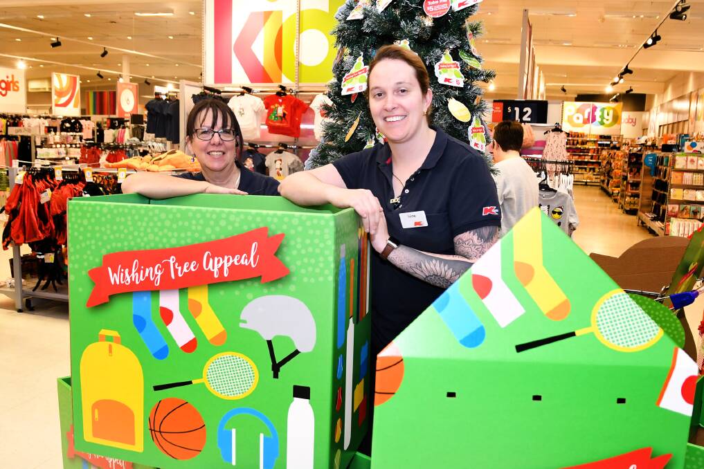 WISHING TREE: Horsham's Kmart employees Shirlene Simmon and Jaime Hillman at the launch of the Kmart Christmas Tree appeal this week. Picture: SAMANTHA CAMARRI 
