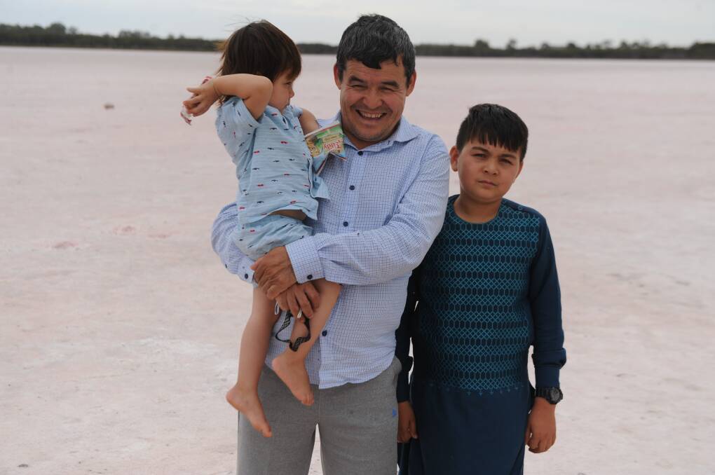 FAMILY FUN: Ranaa, Sarwar and Aliaakbar, of Adelaide, stopped by Pink Lake in Dimboola on their way back from Melbourne. Picture: ALEX DARLING