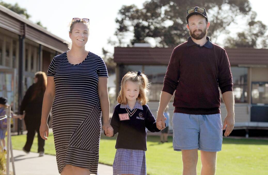 FAMILY TIES: Alice and Mark Adams drop eldest child Boh off at her first day of prep at Holy Trinity Lutheran College. Picture: MATT CURRILL 