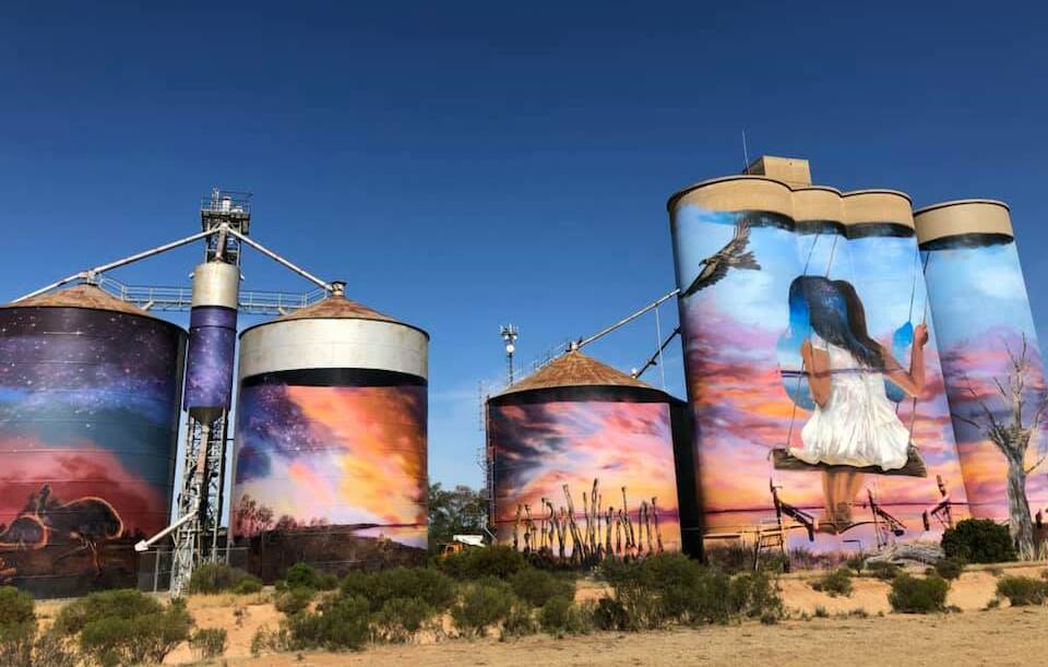 ART IMPACT: Brisbane-based artists Travis Vinson (DRAPL) and Joel Fergie (The Zookeeper) transformed GrainCorp silos in Sea Lake into pieces of art this week. Picture: CONTRIBUTED