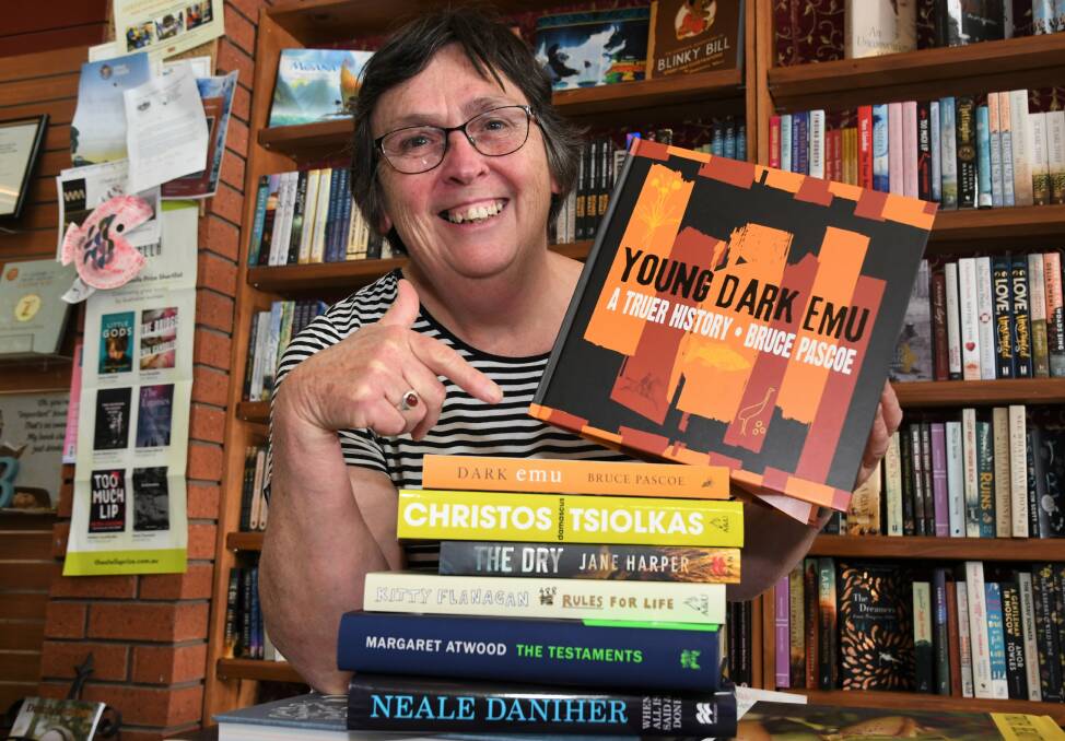 RECOMMENDATIONS: Horsham's Redrock Books and Gallery owner Marian Anderson with her summer read picks. Picture: JADE BATE