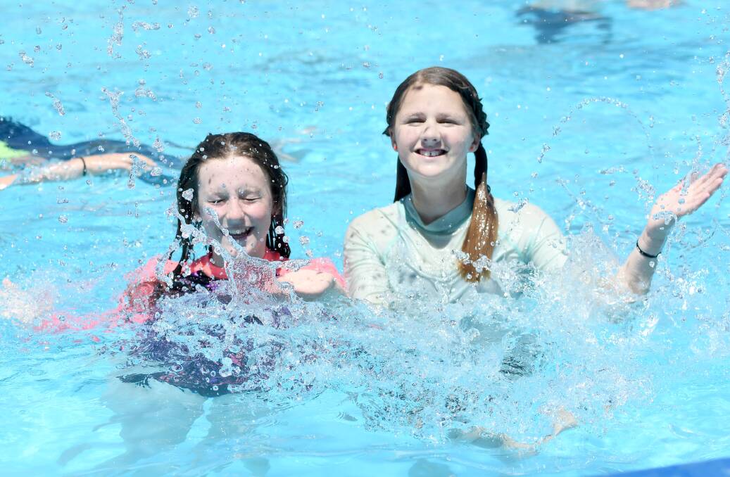 POOL PARTY: Isabella Rand and Stella Wynwood, of Tasmania, cool down at the Horsham Aquatic Centre on Monday. Picture: SAMANTHA CAMARRI