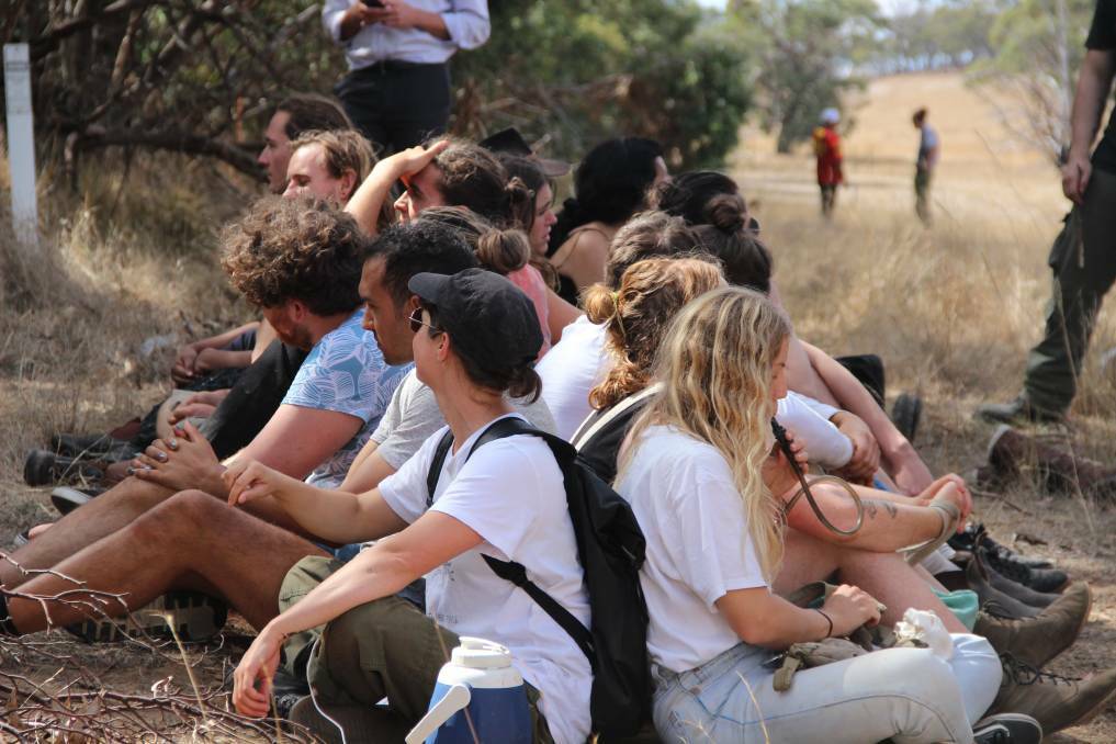 Protesters sit in on Tuesday, anticipating machinery to attempt to enter the camp site. Picture: LACHLAN WILLIAMS. 