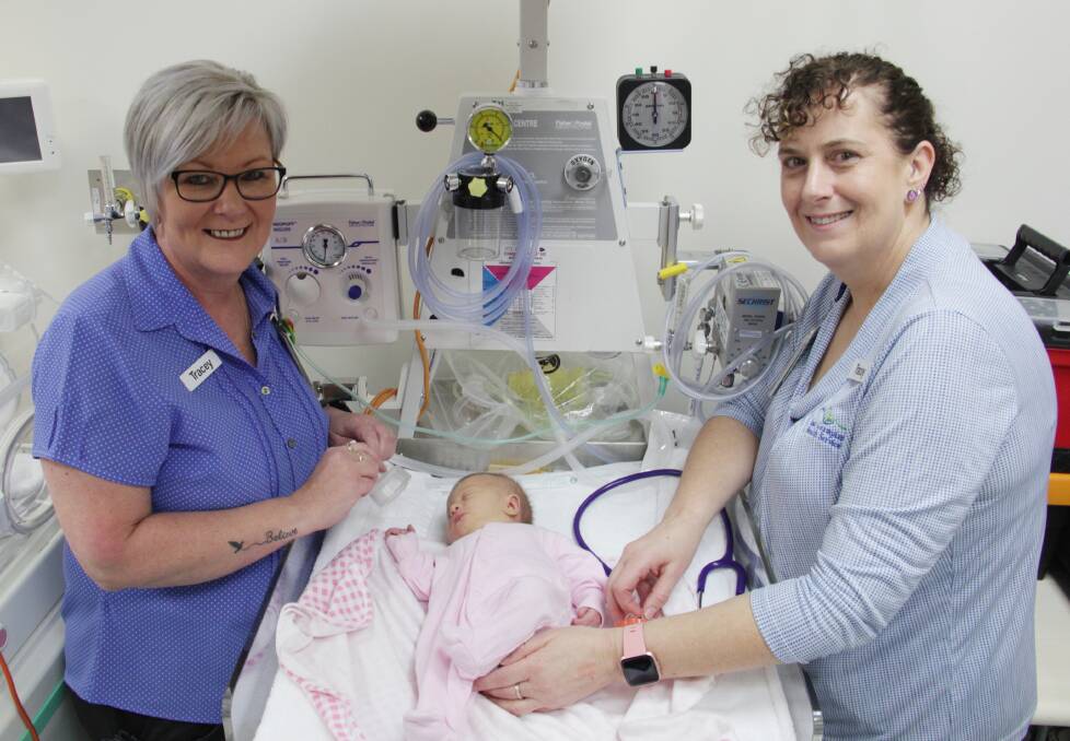 LIFE-SAVING: Tracey Drake and Tracey Walters with the Neopuff and a newborn baby in the Midwifery Unit. Picture: CONTRIBUTED. 