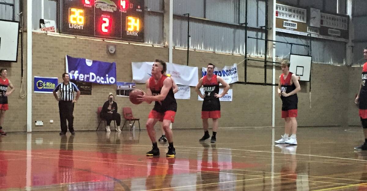 FOCUS: The Redbacks' Dj Woods lines up a free shot while his teammates watch on during the match against the Stawell Wildcats. 