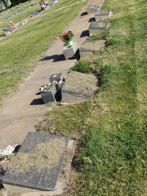 Grass covers headstones. Picture: CONTRIBUTED. 