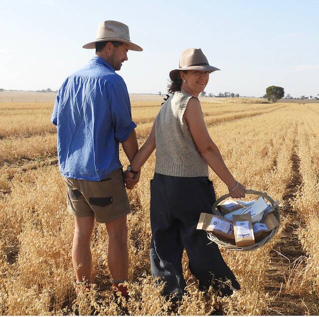 Rupanyup Living owner Claire Morgan and her husband David Morgan in their chickpea crop. Picture: CONTRIBUTED.