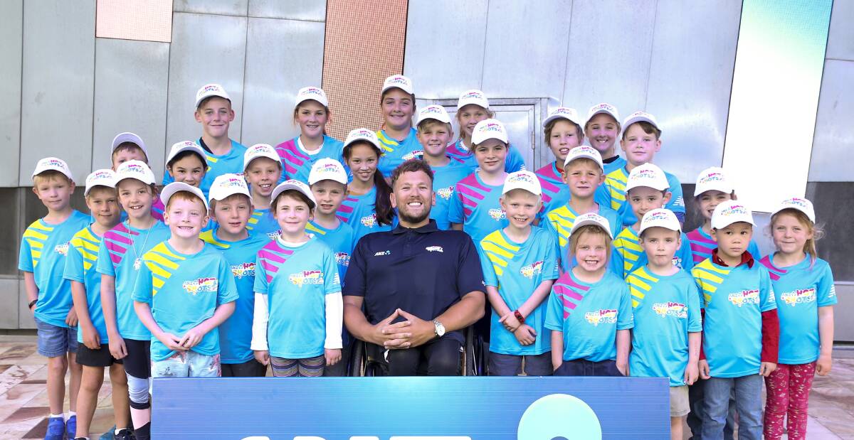 TENNIS STARS: Tatyoon Tennis Club Hotshots with Dyaln Alcott at Melbourne Park during the Australian Open. Picture: CONTRIBUTED.