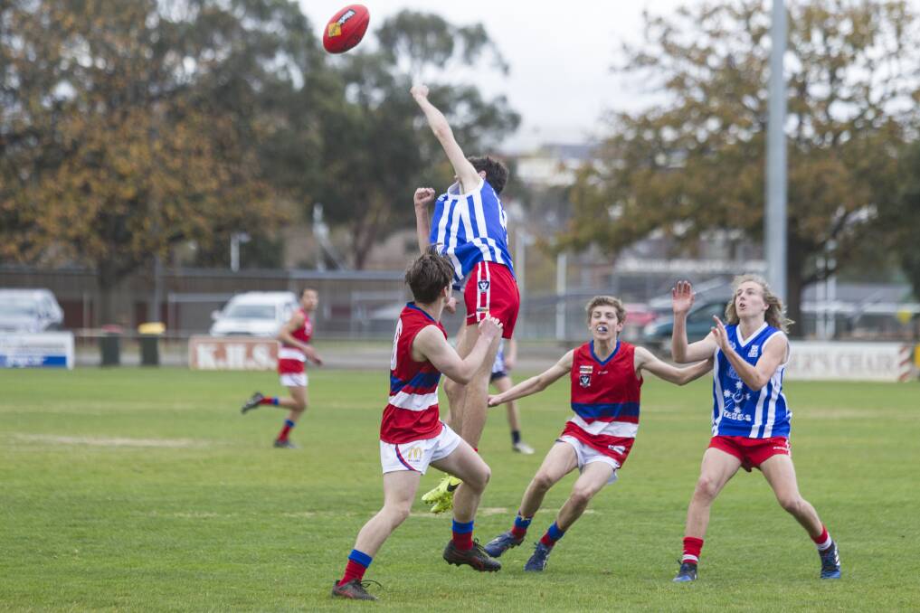 LEAP: Luke Spalding gets air while playing for Ararat. Picture: PETER PICKERING.