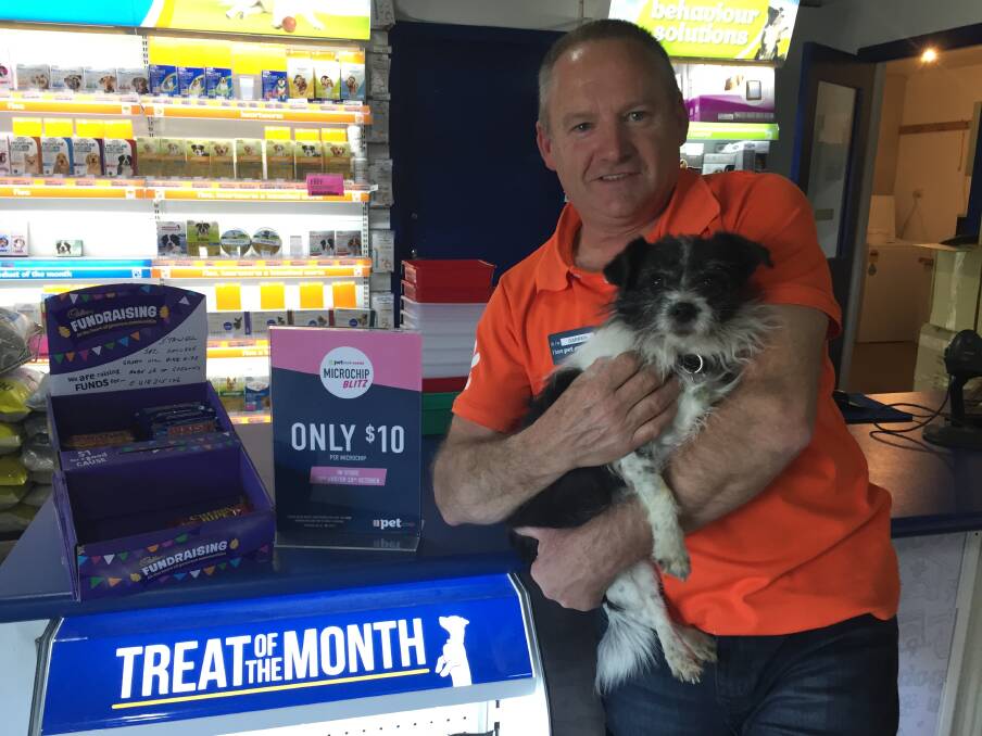 PETstock Stawell's Darren Smith with Jilly the rescue dog.