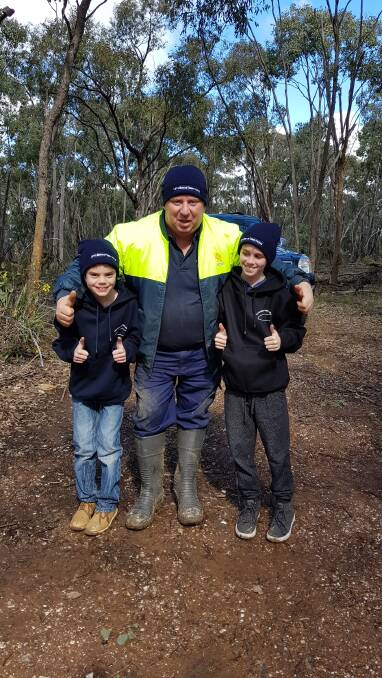 HOPE: Toni Hobson's grandsons, Tyler and Jacob with Daryl Floyd at the Morning Star mine shaft where they continue to search for missing Terry Floyd. 
