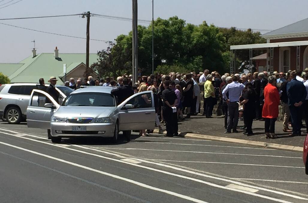 Crowds spill out of St Mary's Church in Ararat during Peter Carthew's funeral.