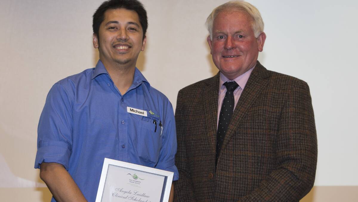 Geoff Laidlaw presents Michael Hermosilla with the Angela Laidlaw Clinical Scholarship at the 2018 East Grampians Health Service annual meeting. 